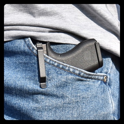 Glock clipped inside pocket of jeans