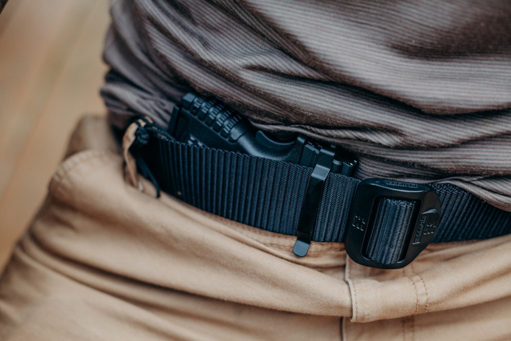 Concealed carry firearm secured with a Clipdraw gun clip worn discreetly inside the waistband.