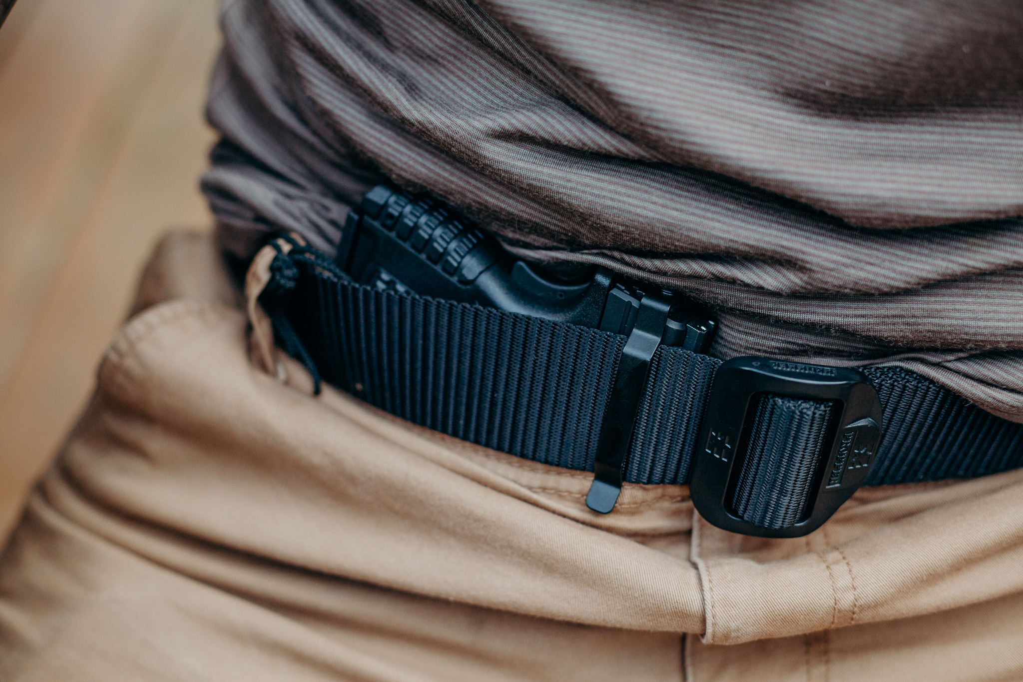 Concealed carry firearm secured with a Clipdraw gun clip worn discreetly inside the waistband.